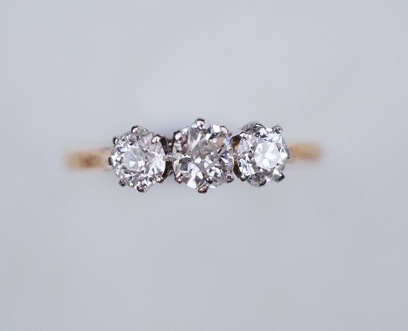 A three-stone diamond ring, early 20th century